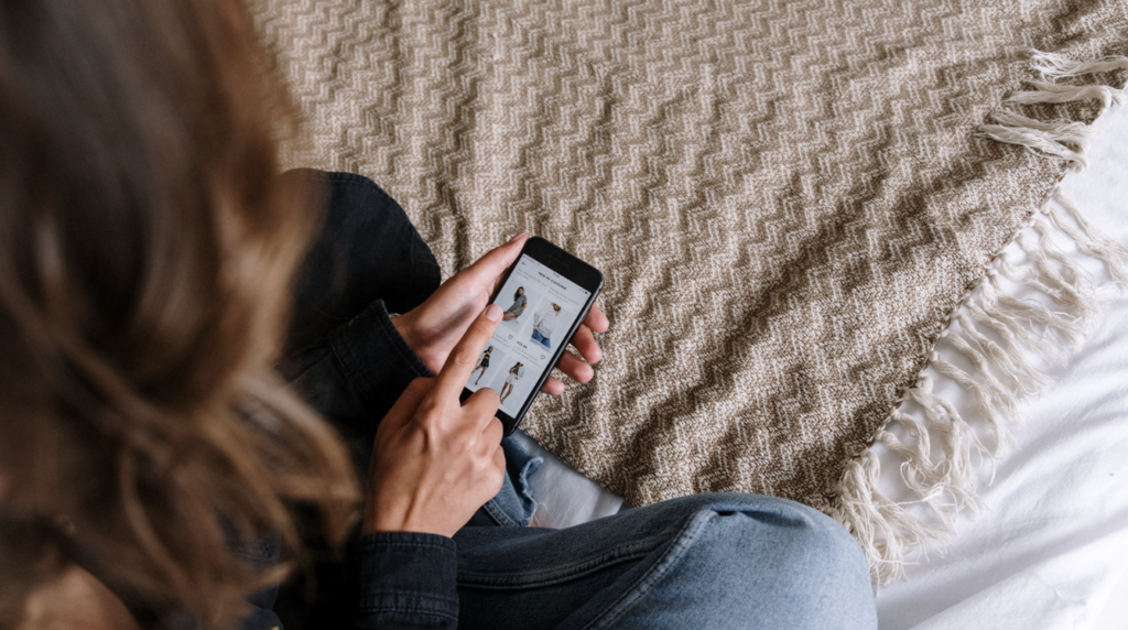 an aerial shot of a woman looking at her phone.